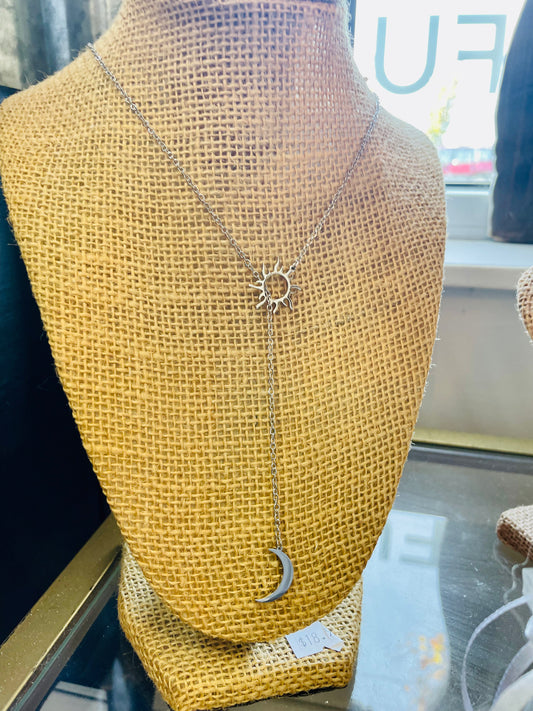 Town & country stainless steel sun & moon necklace.