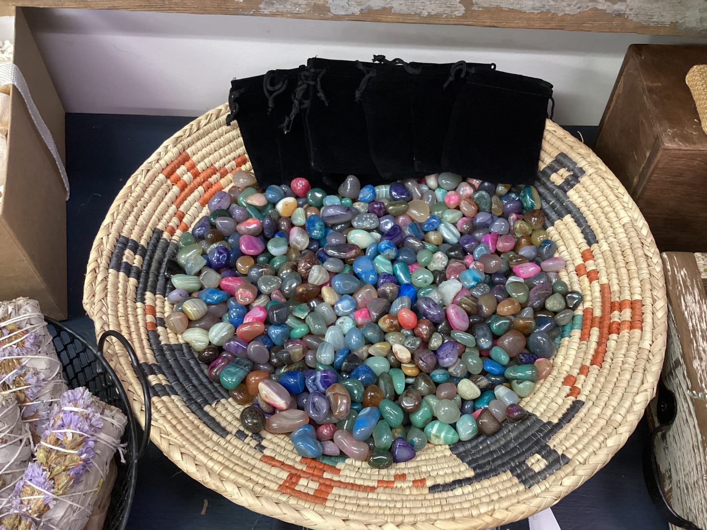 Loose tumbled stones and velvet bag.