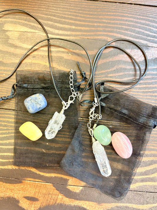 Crystal necklace and stones in bag